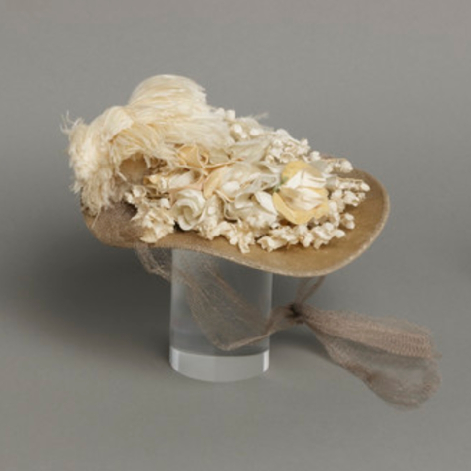 Mildred Blount miniature period hat; Silk velvet with silk plain weave, linen plain weave (buckrum), ostrich feather, and silk net; 2 1/2 × 8 3/4 × 8 3/4 in. (6.35 × 22.23 × 22.23 cm); Gift of Marjorie St. Cyr (CR.75.2.26); courtesy of LACMA collections